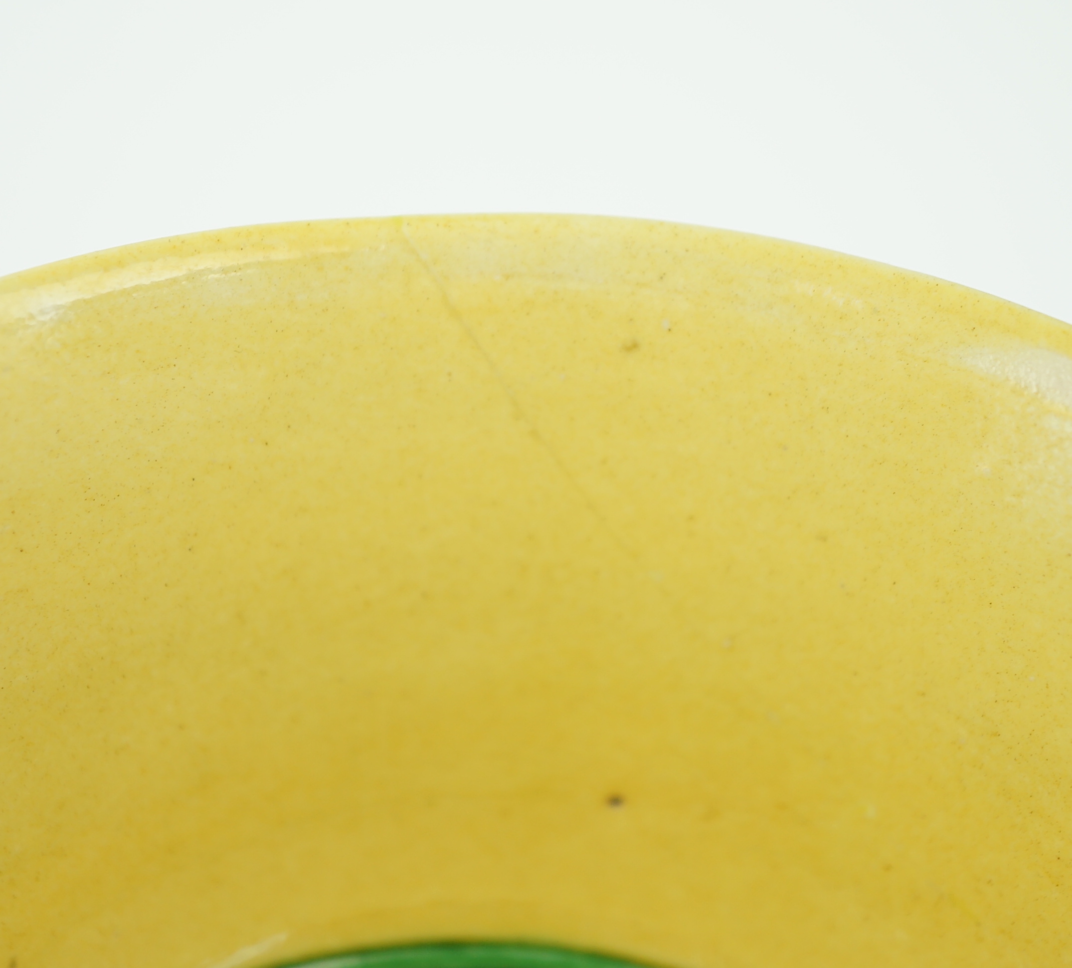 A Chinese green and yellow glazed 'dragon' bowl, Daoguang mark and of the period (1821-50), section of rim broken and restored, hairline cracks